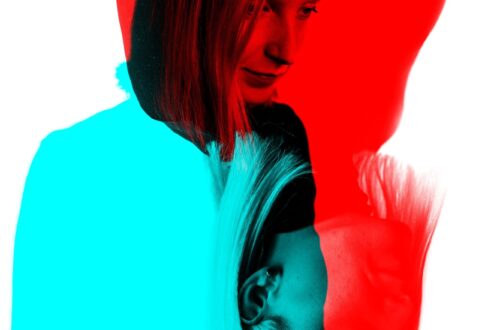 Mirrored image. A girl upside down and on the regular side in blue and red colours.